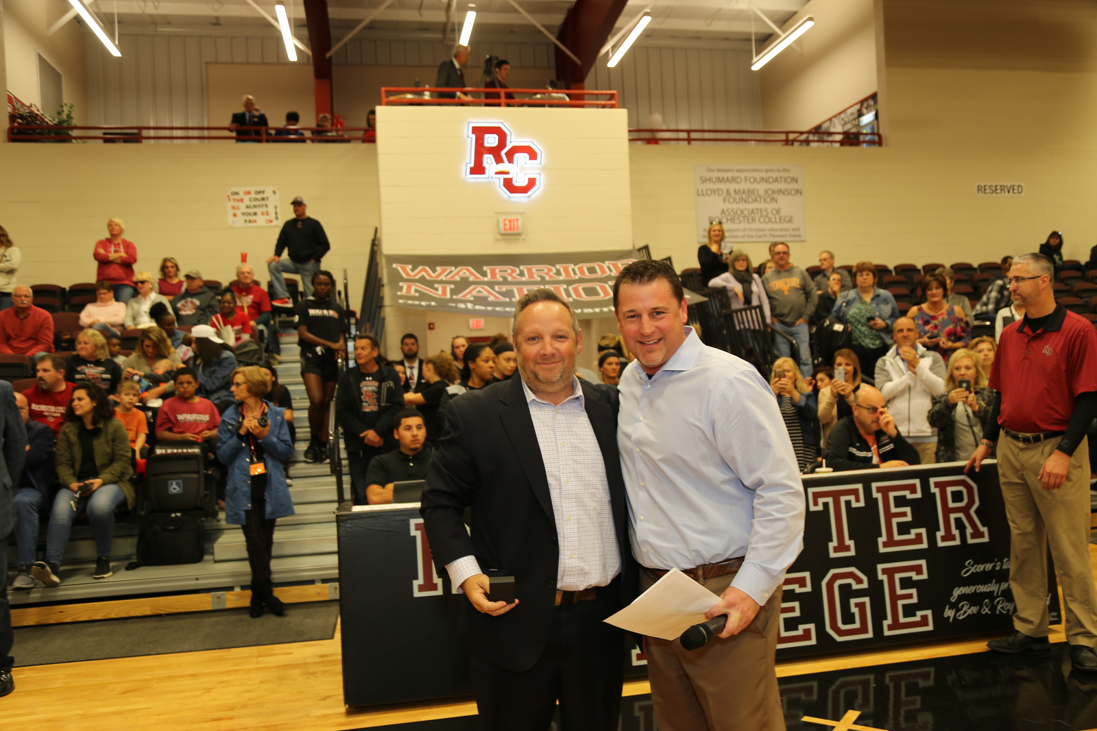 Tague pictured alongside VP of Athletics Dr. Klint Pleasant